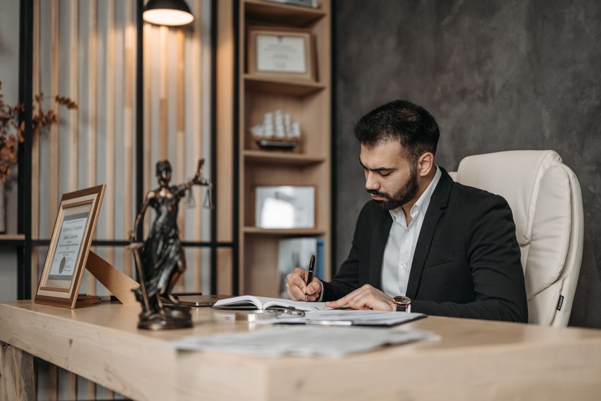 Idris Ashgrove working at his desk.